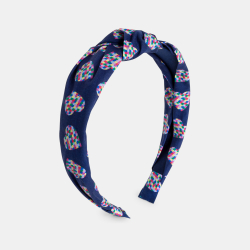 طوق شعر للفتيات وعليه عقدة.